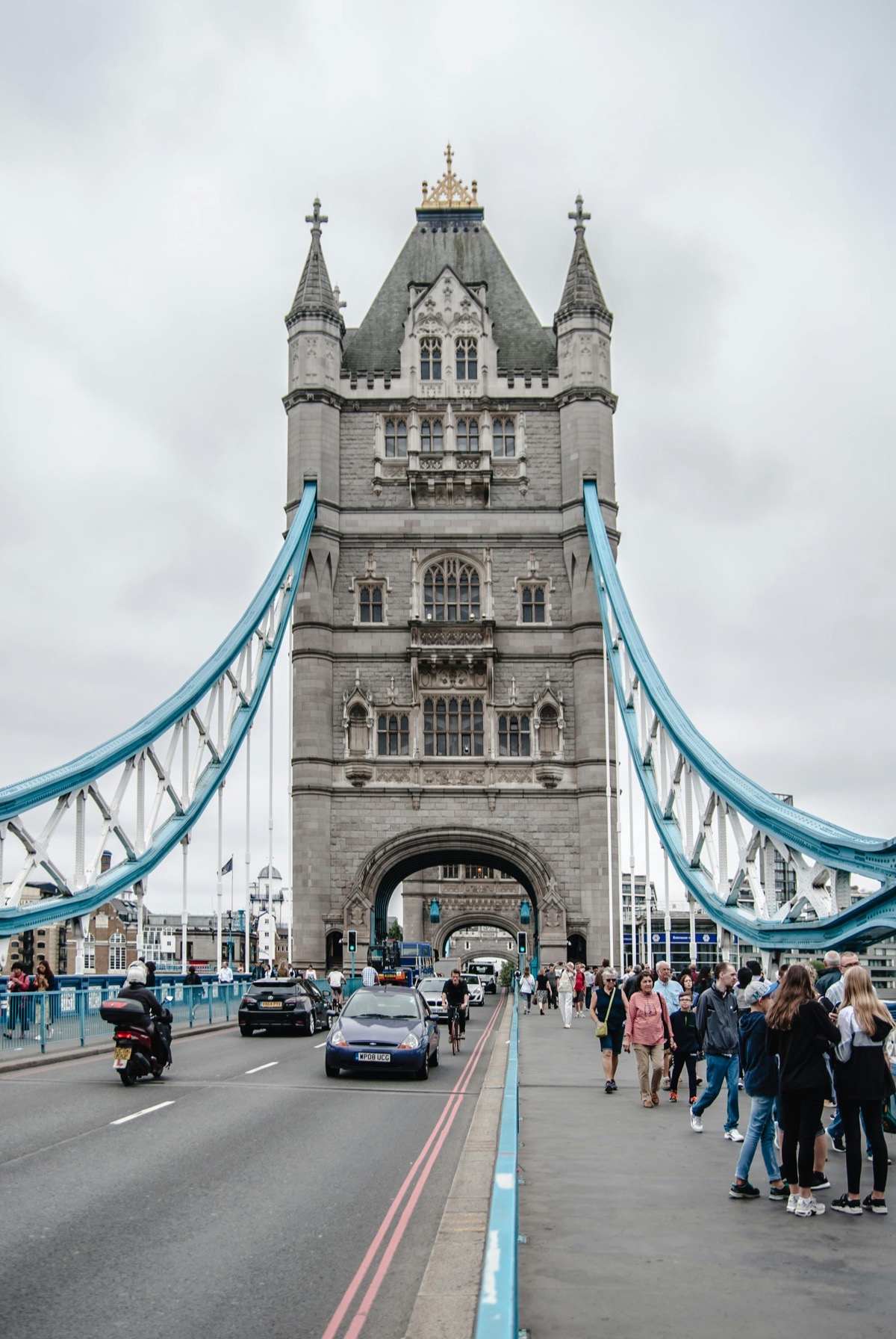 Tower Bridge London with crowds of tourists on walkway - before AI removal